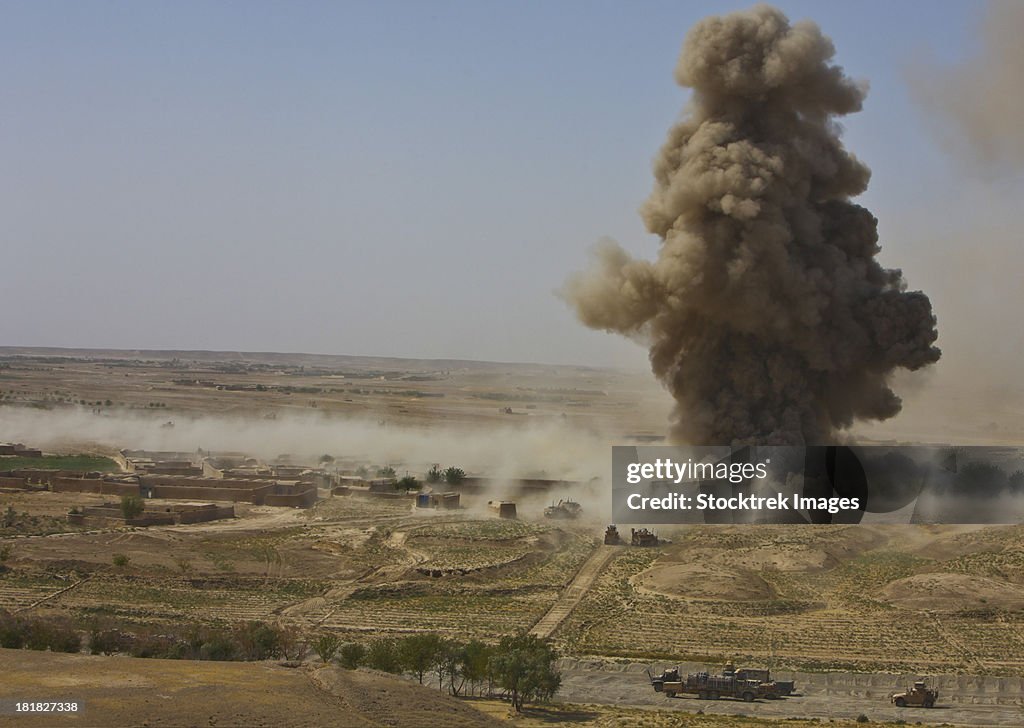 A cloud of dust and debris rises into the air in Afghanistan.