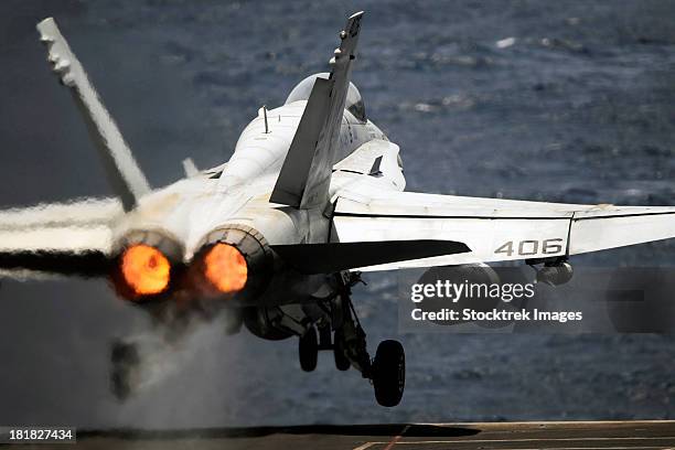 arabian sea, may 17, 2012 - an f/a-18c hornet launches from the nimitz-class aircraft carrier uss abraham lincoln. - afterburner stock pictures, royalty-free photos & images