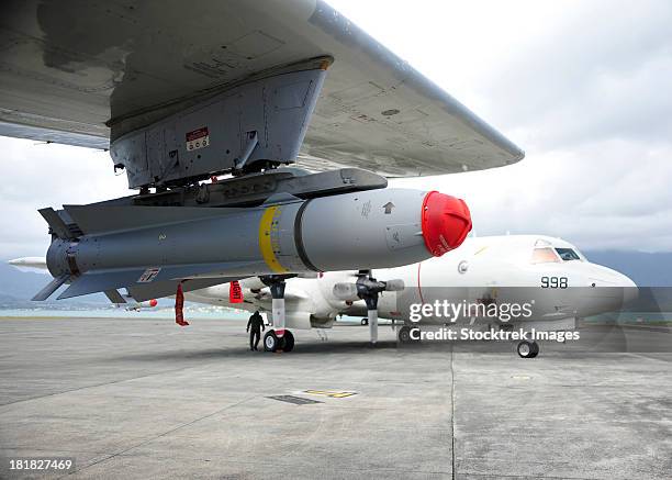 an agm-65 maverick tactical missile is mounted on a p-3c orion. - hawaii missile stock pictures, royalty-free photos & images