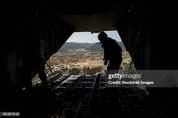 october 31, 2012 - u.s. air force airman finishes pushing out pallets from a u.s. air force c-130h hercules over afghanistan.  - u s open stock pictures, royalty-free photos & images