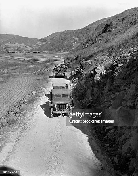 january 17, 1951 - tank-led patrol of leathernecks hunt down north korean guerrillas somewhere in the mountainous region of korea. - 1951 stock pictures, royalty-free photos & images