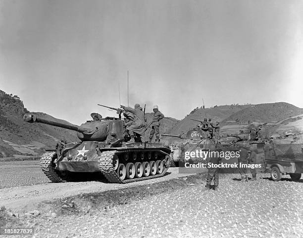 january 17, 1951 - tank-led patrol of leathernecks hunt down north korean guerrillas somewhere in the mountainous region of korea. - 1951 stock pictures, royalty-free photos & images