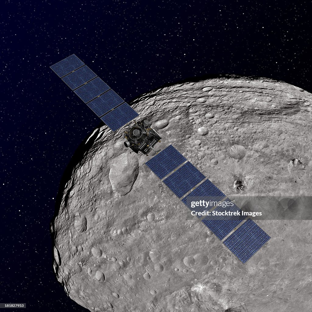 Artist's concept showing NASA's Dawn spacecraft orbiting the giant asteroid Vesta.