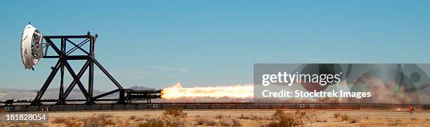 a trial run on a rocket sled test fixture powered by rockets. - rocket engine stock pictures, royalty-free photos & images