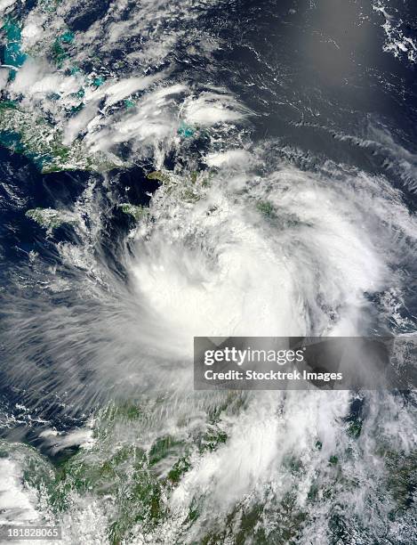 august 24, 2012 - tropical storm isaac moving through the eastern caribbean sea.  - tempesta tropicale isaac foto e immagini stock