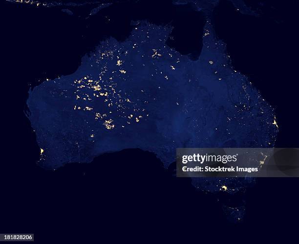 satellite view showing the night lights of australia. - australia from space stock-fotos und bilder