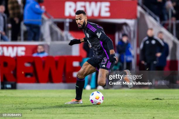 Eric Maxim Choupo-Moting of Muenchen runs with the ball during the Bundesliga match between 1. FC Koeln and FC Bayern Muenchen at RheinEnergieStadion...