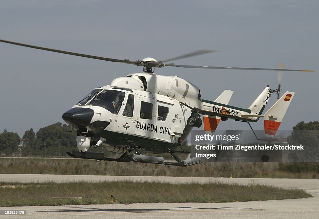 A BK117 utility helicopter of the Spanish Civil Guard, landing in Rota, Spain.