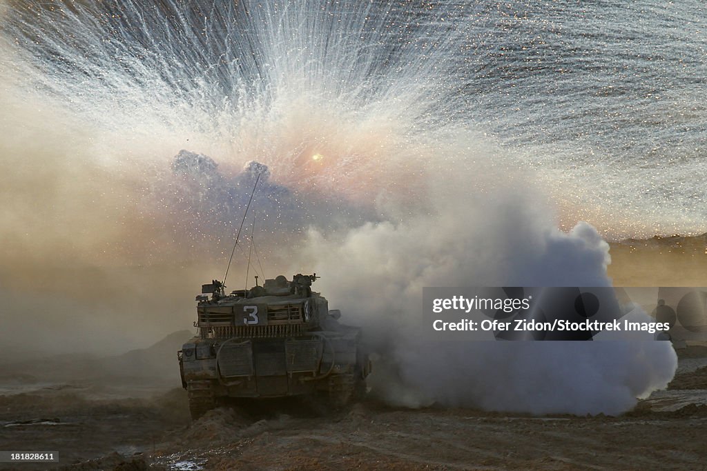 An Israel Defense Force Merkava Mark II main battle tank during live fire exercise in the Negev desert.