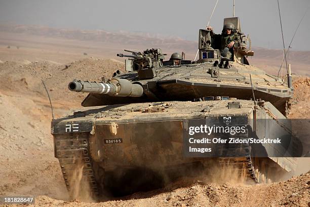 an israel defense force merkava mark iv main battle tank. note the instructor's chair fitted on board the tank's turret - military tank fotografías e imágenes de stock
