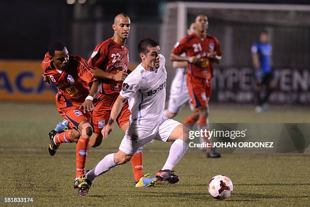 Guatemala's Comunicacione's Edward Santeliz vies for the ball with Trinidad and Tobago's Caledonia Marcus Ambrose during their Concacaf Champions...