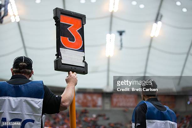 Referee holds a third down marker in a football game between Syracuse Orange and Wagner Seahawks on September 14, 2013 at the Carrier Dome in...