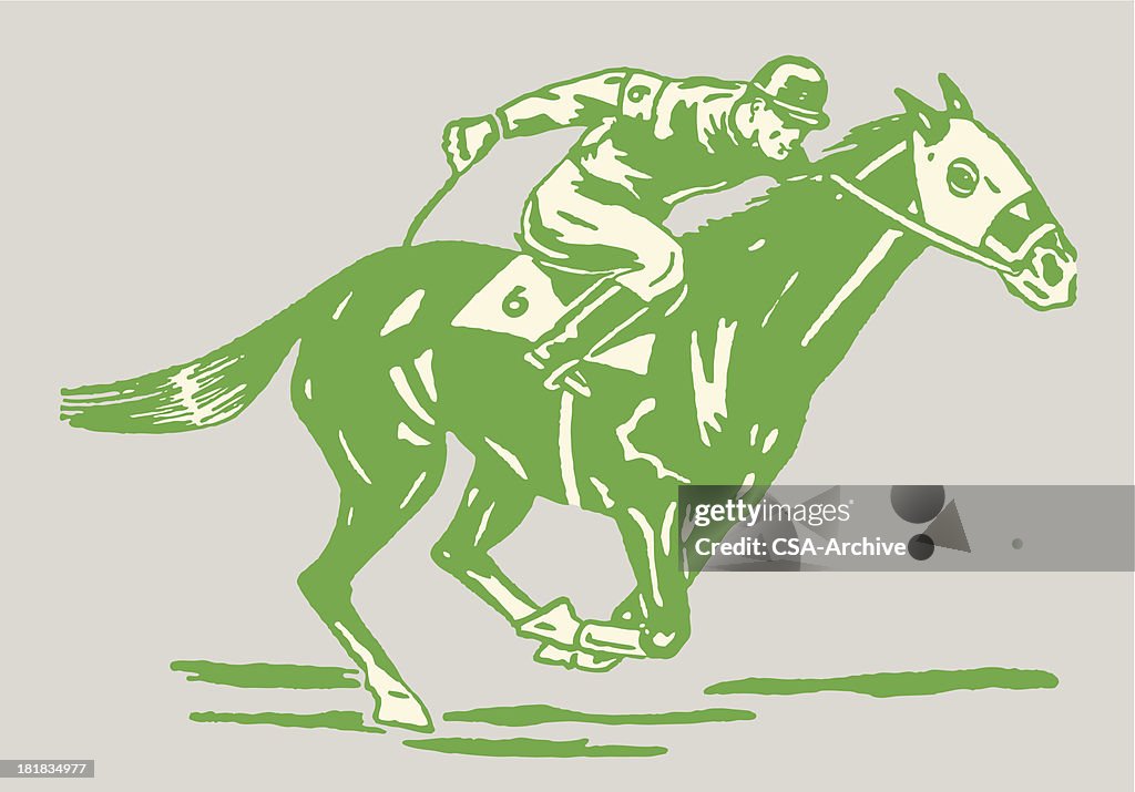 Jockey auf Pferd im Rennen