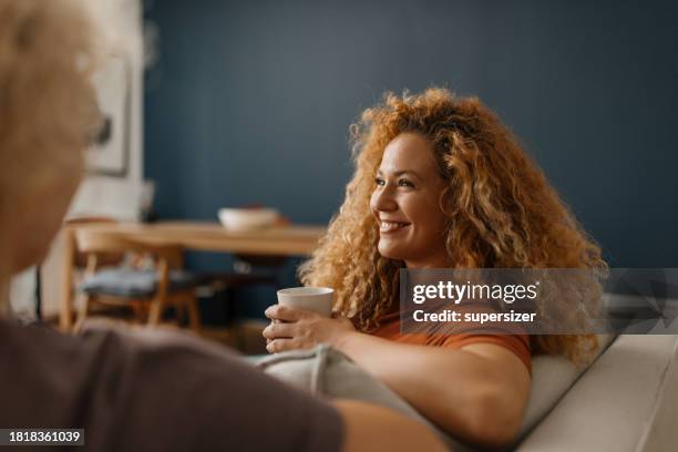 mother-daughter embrace - curly hair stock pictures, royalty-free photos & images