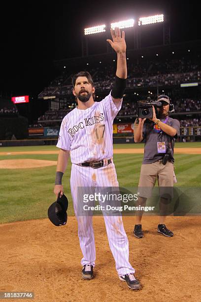 Todd Helton of the Colorado Rockies acknowledges the standing ovation from the fans after he played his last home game at Coors Field on September...