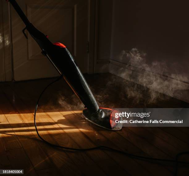 a person mops the floor using an electric steam mop - maid hoovering stock pictures, royalty-free photos & images