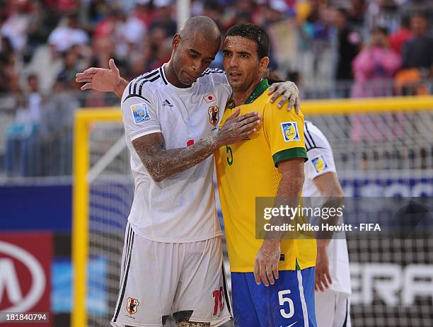 Daniel of Brazil consoles Ozu Moreira of Japan after the FIFA Beach Soccer World Cup Tahiti 2013 Quarter Final match between Brazil and Japan at the...