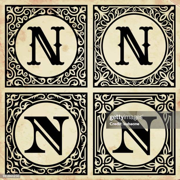 old paper with decorative letter n - letter n stock illustrations