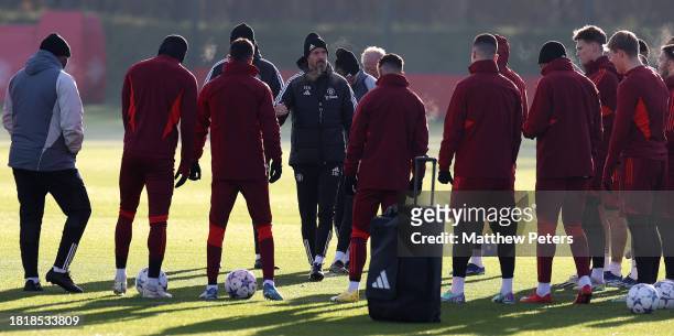 Manager Erik ten Hag of Manchester United talks to the squad during a first team training session at Carrington Training Ground on November 28, 2023...