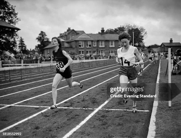 British athletes Diane Leather and Joy Jordan competing in an athletics event at Motspur Park, June 12th 1958.