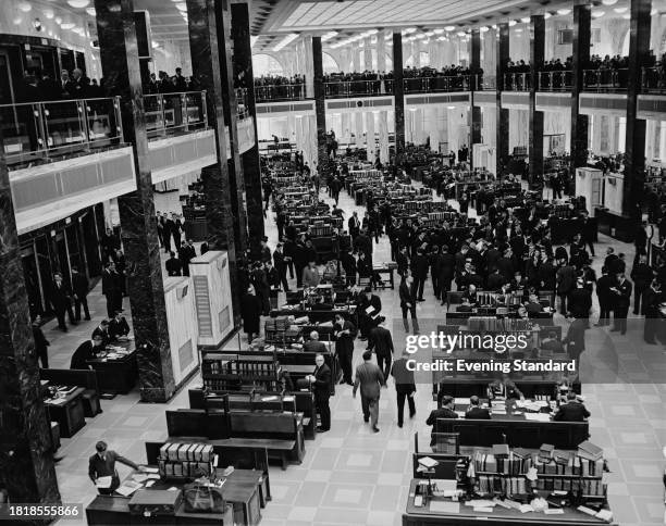 Elevated view of the underwriting room in the new building extension at Lloyd's of London at 51 Lime Street, London, April 17th 1958.