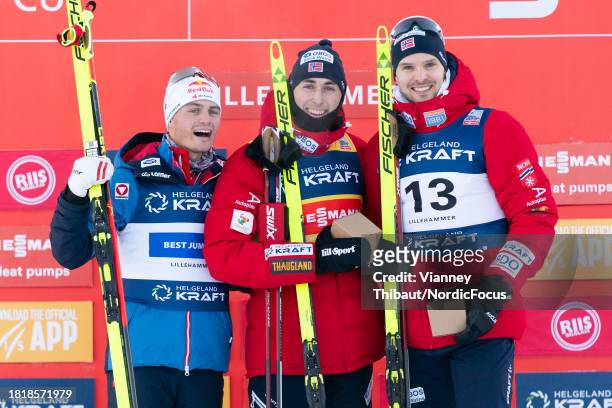 Johannes Lamparter of Austria takes second place, Jarl Magnus Riiber of Norway takes first place, Joergen Graabak of Norway takes third place during...
