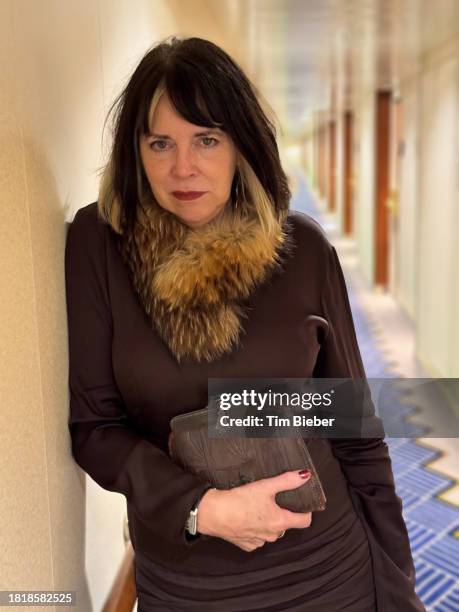 mature woman leaning against wall. - mink stole shawl stock pictures, royalty-free photos & images