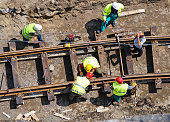 A group of men constructing a railway