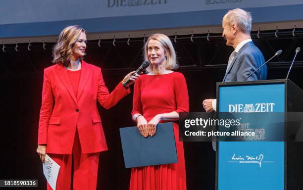 December 2023, Hamburg: Estonian Prime Minister Katja Kallas stands between presenter Julia-Niharika Sen and Janusz Reiter, former Polish Ambassador...