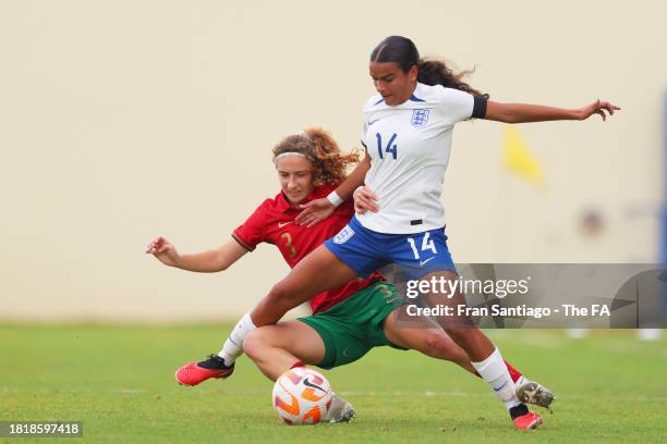 Ava Baker of England U19 competes for the ball with Carolina Ferreira of Portugal U19 during a match between England U19 and Portugal U19 at Estadio...
