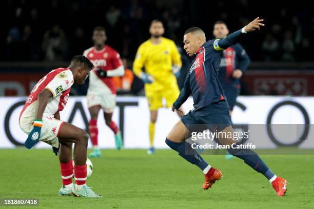 Kylian Mbappe of PSG, left Wilfried Singo of Monaco in action during the Ligue 1 Uber Eats match between Paris Saint-Germain and AS Monaco at Parc...