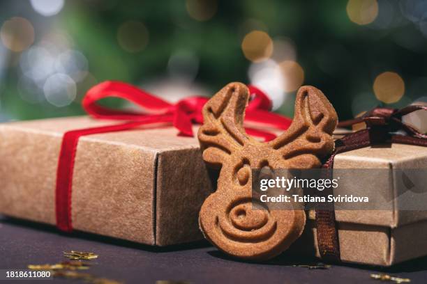 christmas gingerbread cookies closeup and defocused lights - biscuit tin stock pictures, royalty-free photos & images