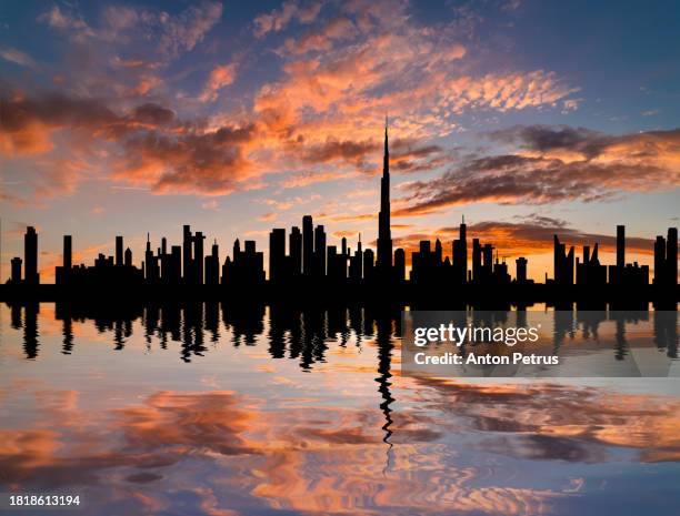 city skyline in dubai at sunset - dubai creek stock pictures, royalty-free photos & images