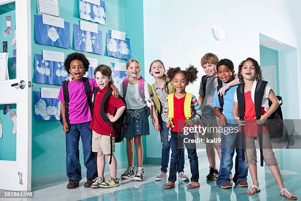 children in school hallway - school pupil stock pictures, royalty-free photos & images