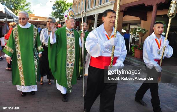 The Archbishop of Santa Fe, Michael Sheehan, blesses the artworks for sale at the annual Spanish Market in Santa Fe, New Mexico. Each July, hundreds...