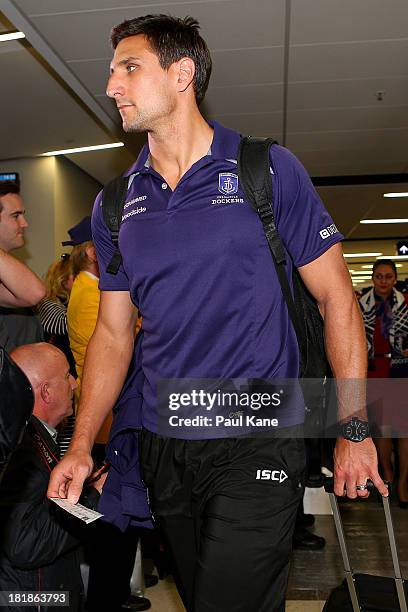 Matthew Pavlich prepares to board the plane to Melbourne at the Perth Airport on September 26, 2013 in Perth, Australia. The Dockers play Hawthorn in...