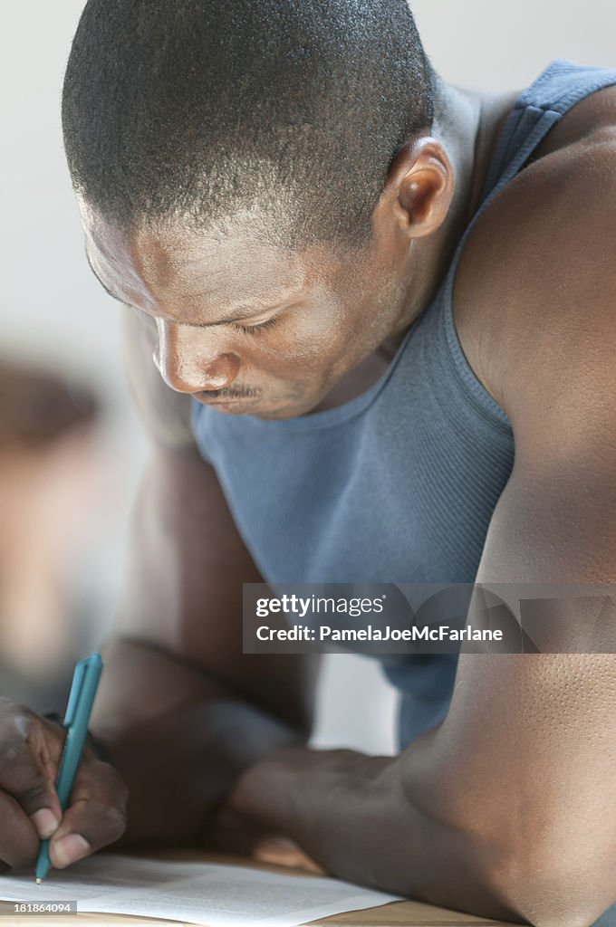 Attractive, Young African American Man Writing