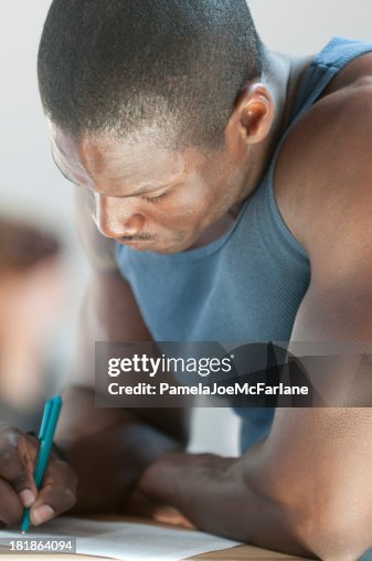 Attractive, Young African American Man Writing Attractive, Young African American Man Writing