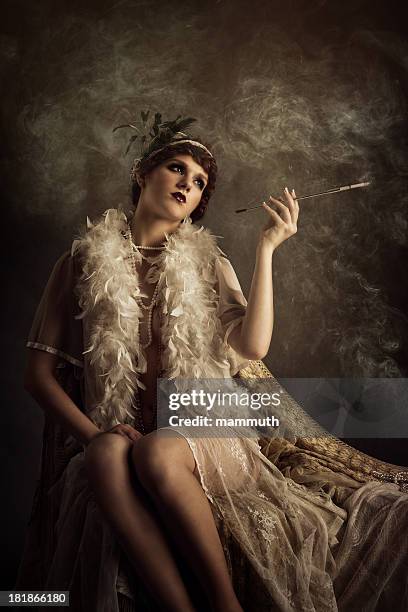 retro woman smoking cigarette - boa stockfoto's en -beelden