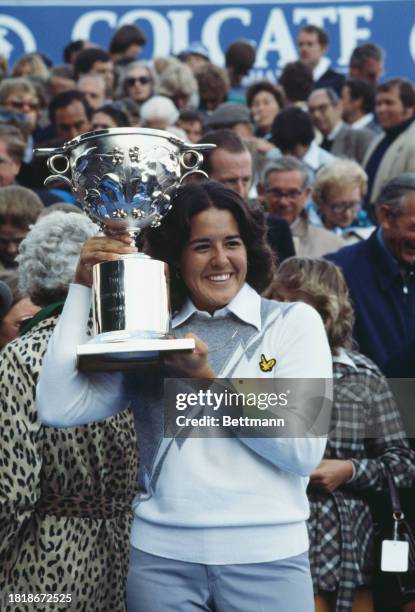 American golfer Nancy Lopez holding up the trophy after winning the European LPGA Championship at Sunningdale in England, August 7th 1978.