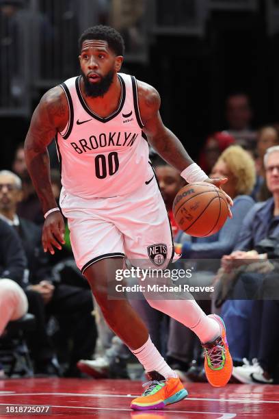 Royce O'Neale of the Brooklyn Nets dribbles against the Chicago Bulls in the first half of the NBA In-Season Tournament at the United Center on...