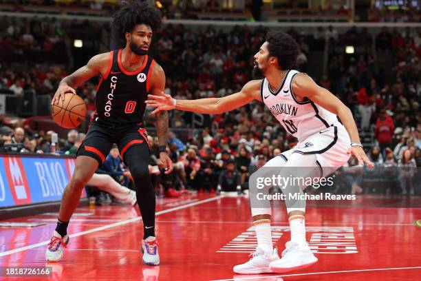 Coby White of the Chicago Bulls is defended by Spencer Dinwiddie of the Brooklyn Nets in the first half of the NBA In-Season Tournament at the United...