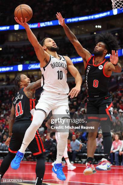Ben Simmons of the Brooklyn Nets goes up for a layup against Coby White of the Chicago Bulls in the second half of the NBA In-Season Tournament at...
