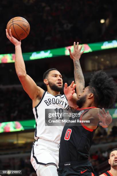 Ben Simmons of the Brooklyn Nets shoots over Coby White of the Chicago Bulls in the second half of the NBA In-Season Tournament at the United Center...