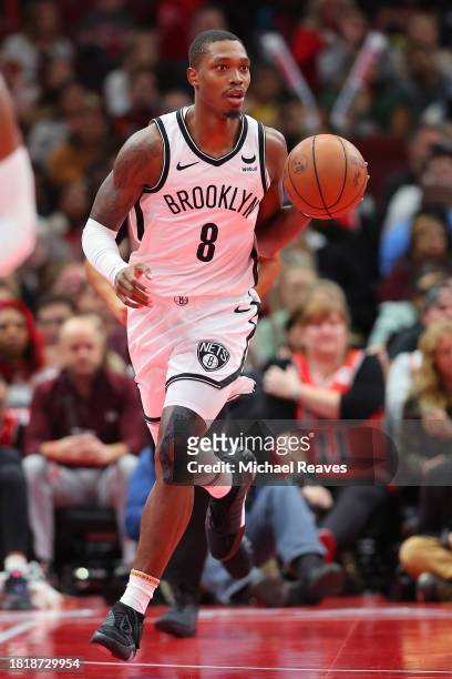 Lonnie Walker IV of the Brooklyn Nets dribbles against the Chicago Bulls in the second half of the NBA In-Season Tournament at the United Center on...