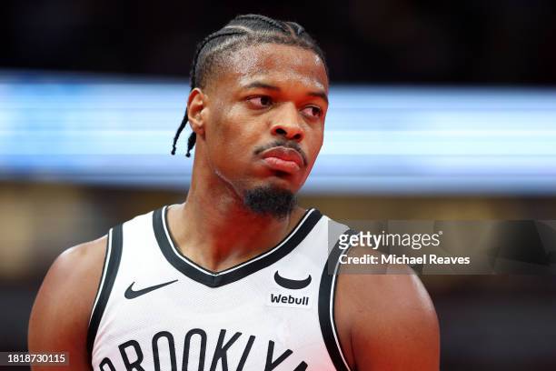 Dennis Smith Jr. #4 of the Brooklyn Nets looks on against the Chicago Bulls in the second half of the NBA In-Season Tournament at the United Center...