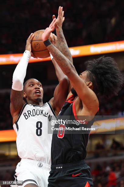 Lonnie Walker IV of the Brooklyn Nets shoots over Coby White of the Chicago Bulls in the second half of the NBA In-Season Tournament at the United...