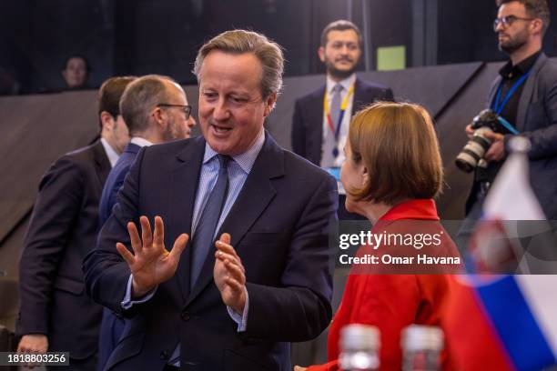 David Cameron, Secretary of State for Foreign, Commonwealth and Development Affairs of the United Kingdom speaks with Romanian Foreign Minister...