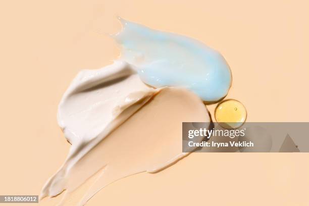 texture of cosmetic products - skincare face cream, refreshing hydration water cream or face gel, hair mask, hand cream and face serum on natural beige background. - retinol stock pictures, royalty-free photos & images