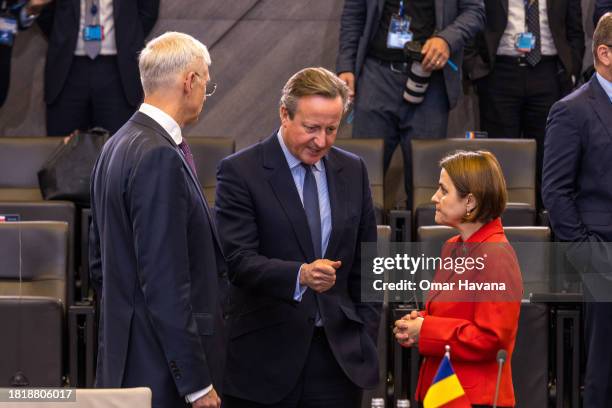 David Cameron, Secretary of State for Foreign, Commonwealth and Development Affairs of the United Kingdom speaks with Romanian Foreign Minister...